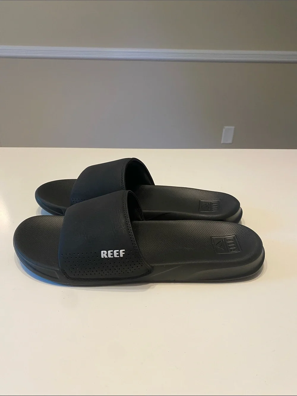 Reef Men’s Black Slide Sandals with White Logo